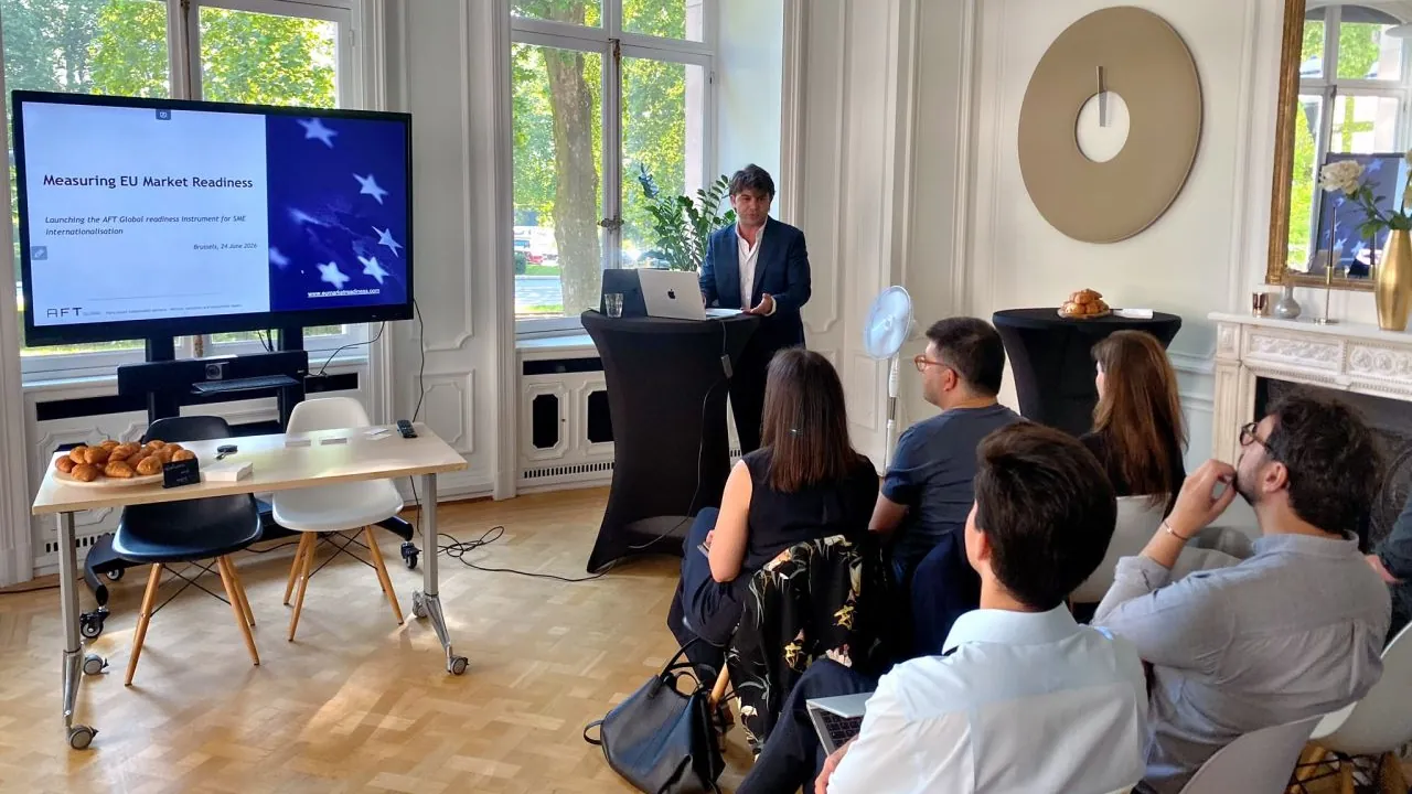 A speaker presents the EU Market Readiness Instrument to a seated audience in Brussels.